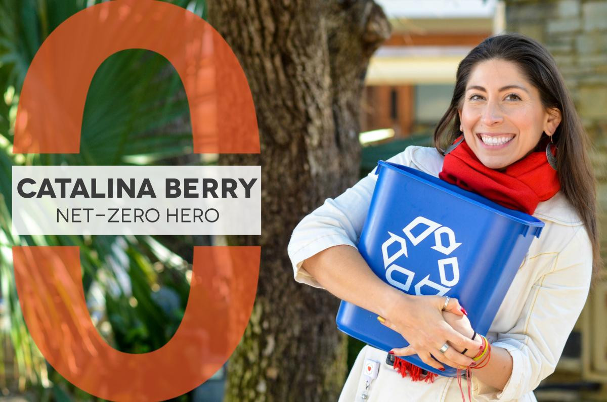 Catalina Berry holding a recycling bin and smiling.