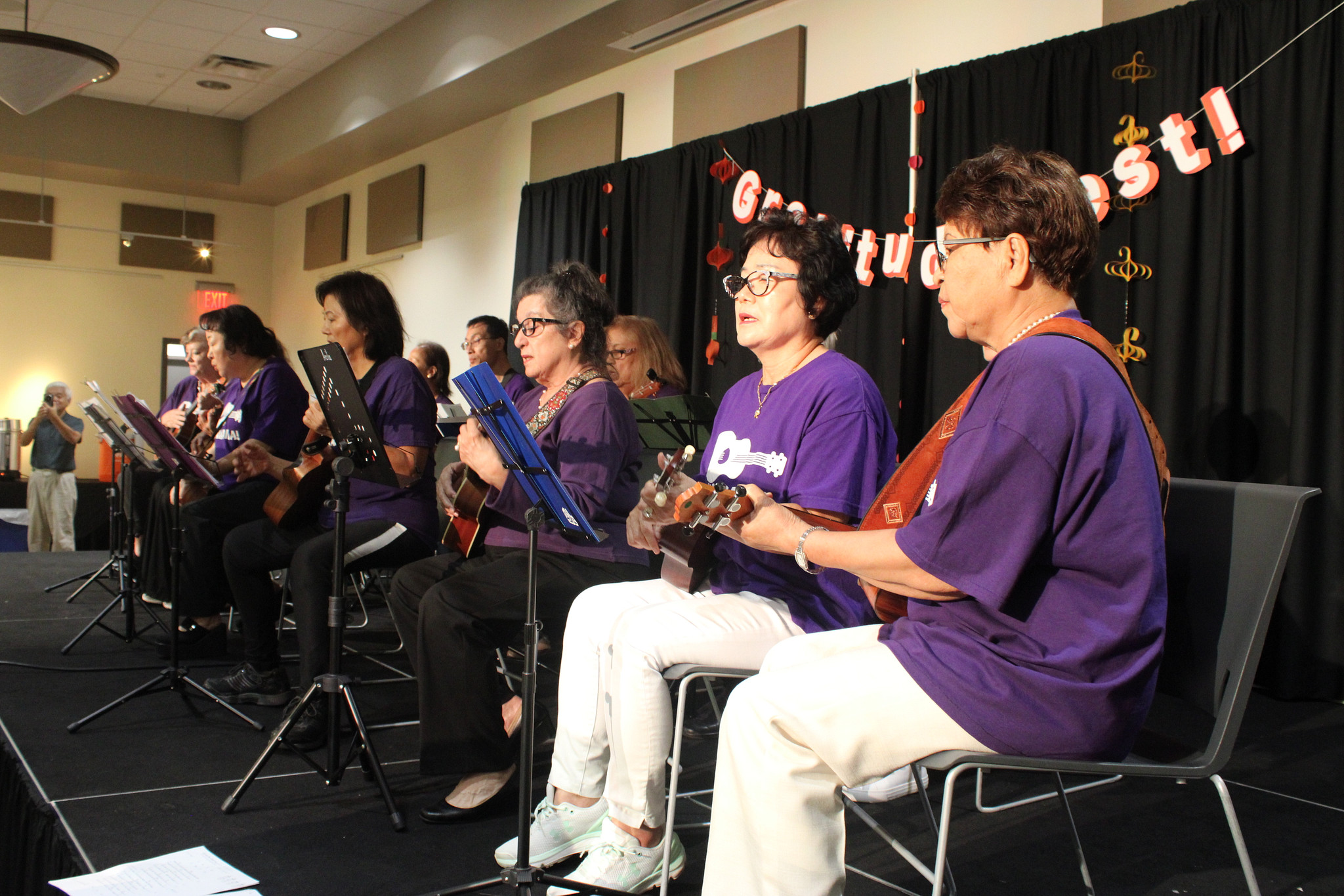 Senior Program participants play ukelele at Gratitude Fest