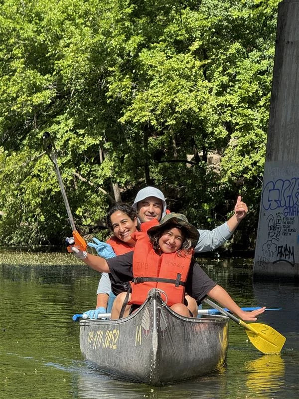 A family in a canoe during Family Creek Clean Camp