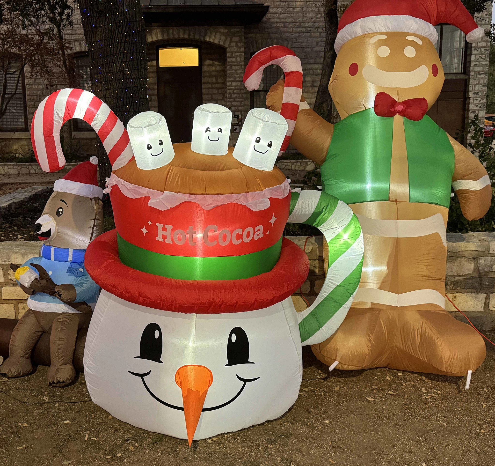 Snowman head with hot chocolate hat and gingerbread man Christmas inflatable