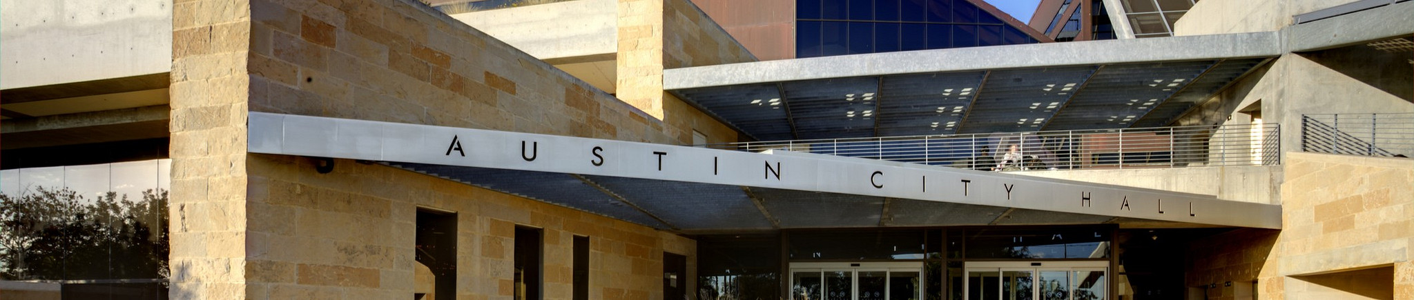 Banner with exterior of Austin City Hall