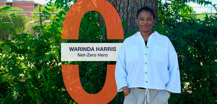 Warinda standing, smiling at camera in front of greenery. Text reads, Warinda Harris, Net-Zero Hero.