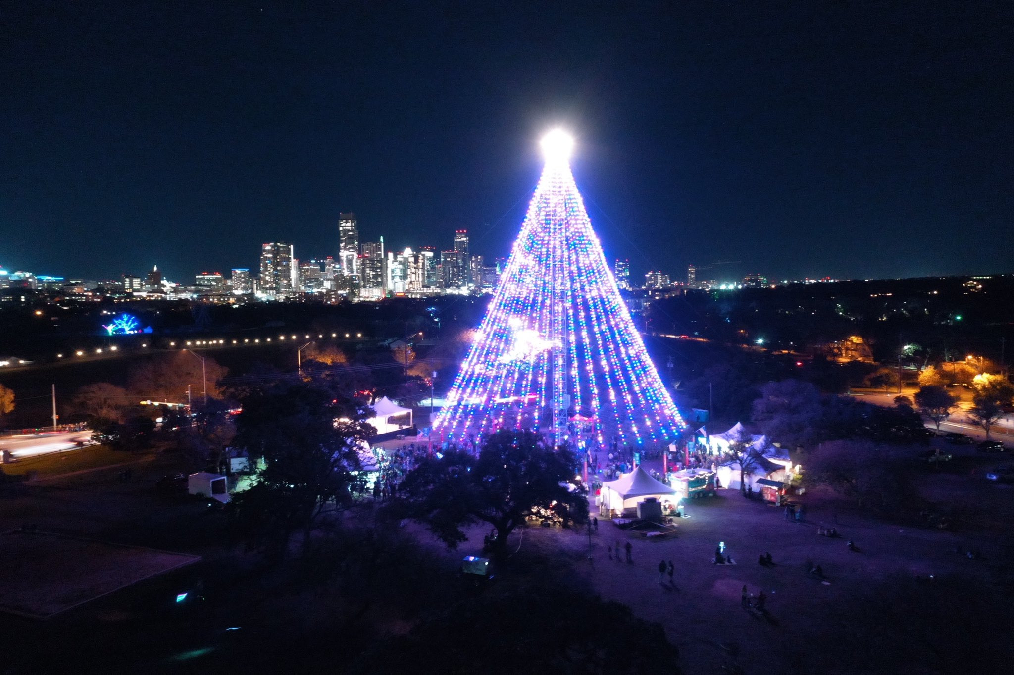 An aerial view of the Zilker holiday tree in 2019 at night
