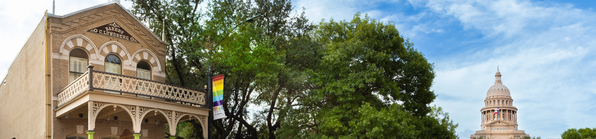 Banner with the Old Bakery and Emporium and the State Capitol building in the background