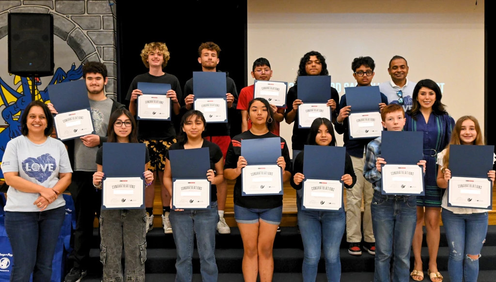 Awardees holding their Flood Safety Video Contest certificates.