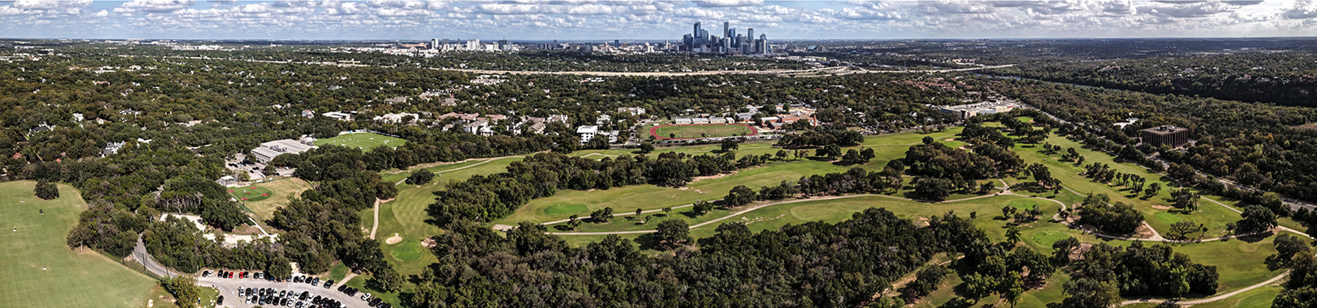 Aerial view of the Lion's Municipal Golf Course with Austin skyline.