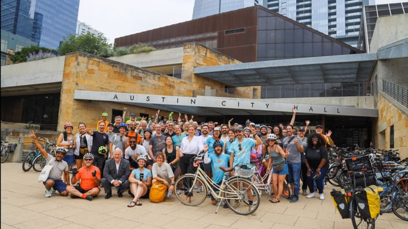 People gather in front of Austin City Hall for Bike to Work Day in 2025.