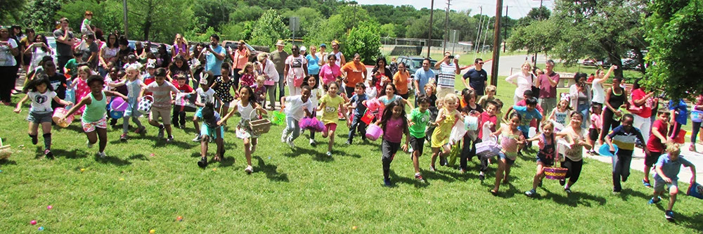 Large group of youth running with Easter baskets