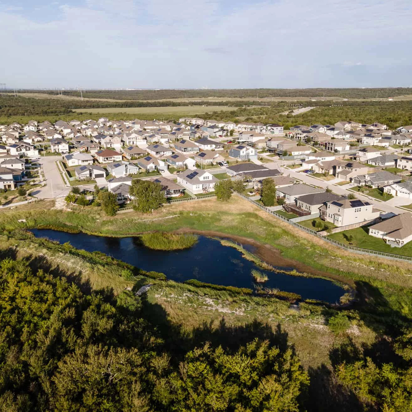 Drone image of Whisper Valley neighborhood and surrounding landscape.
