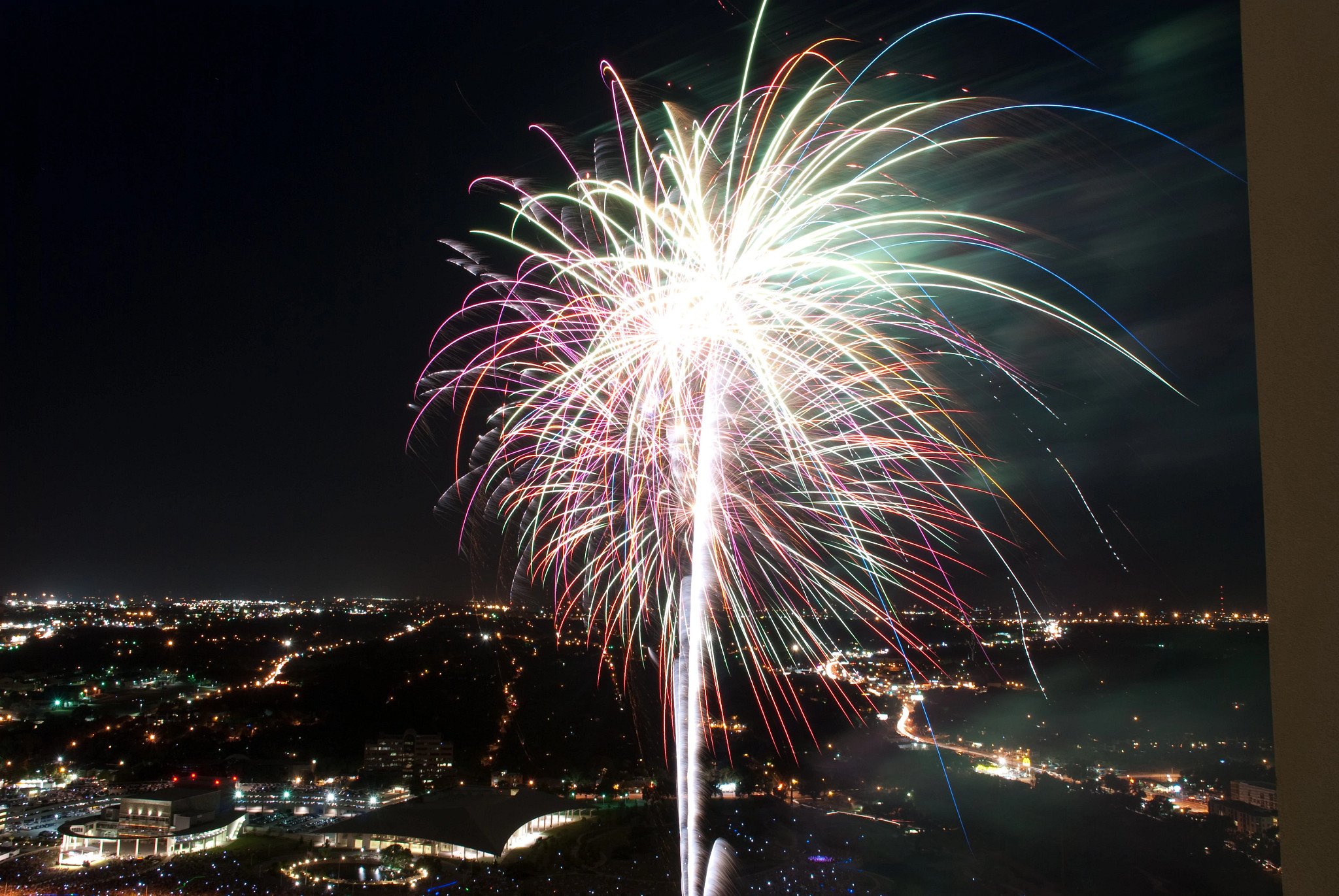 Image of fireworks bursting above city.
