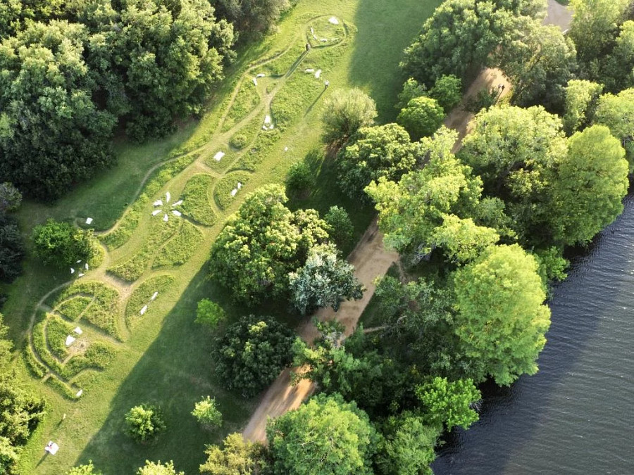 Overhead view of a public art installation involving grass cut in shapes