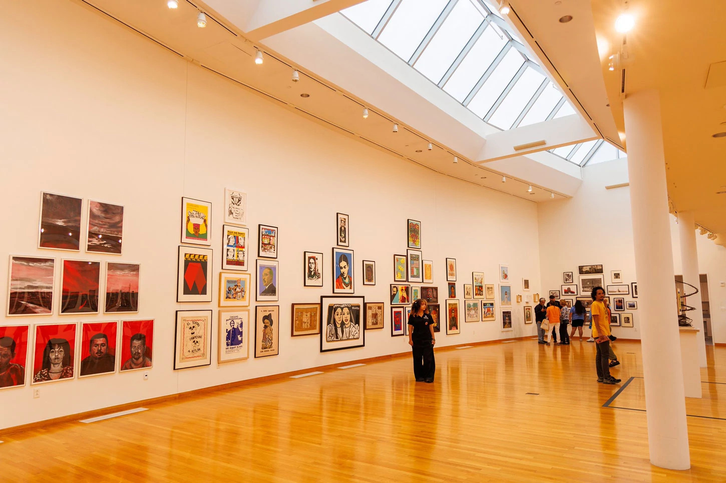 people walking through an art gallery