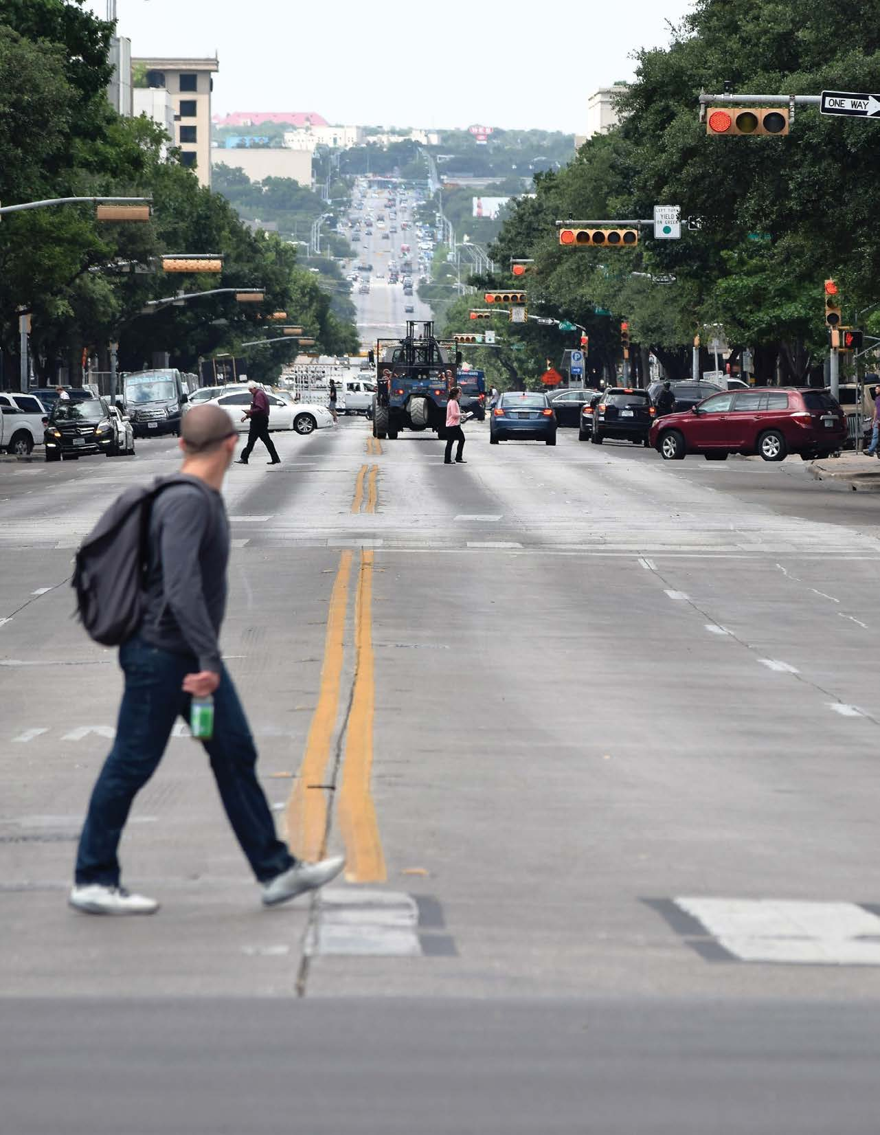 Person crossing the street in Austin.