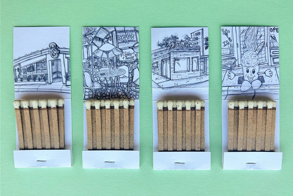 An image of four matchbooks laid out evenly and opened up with drawings of former Austin institutions on the inner cover.