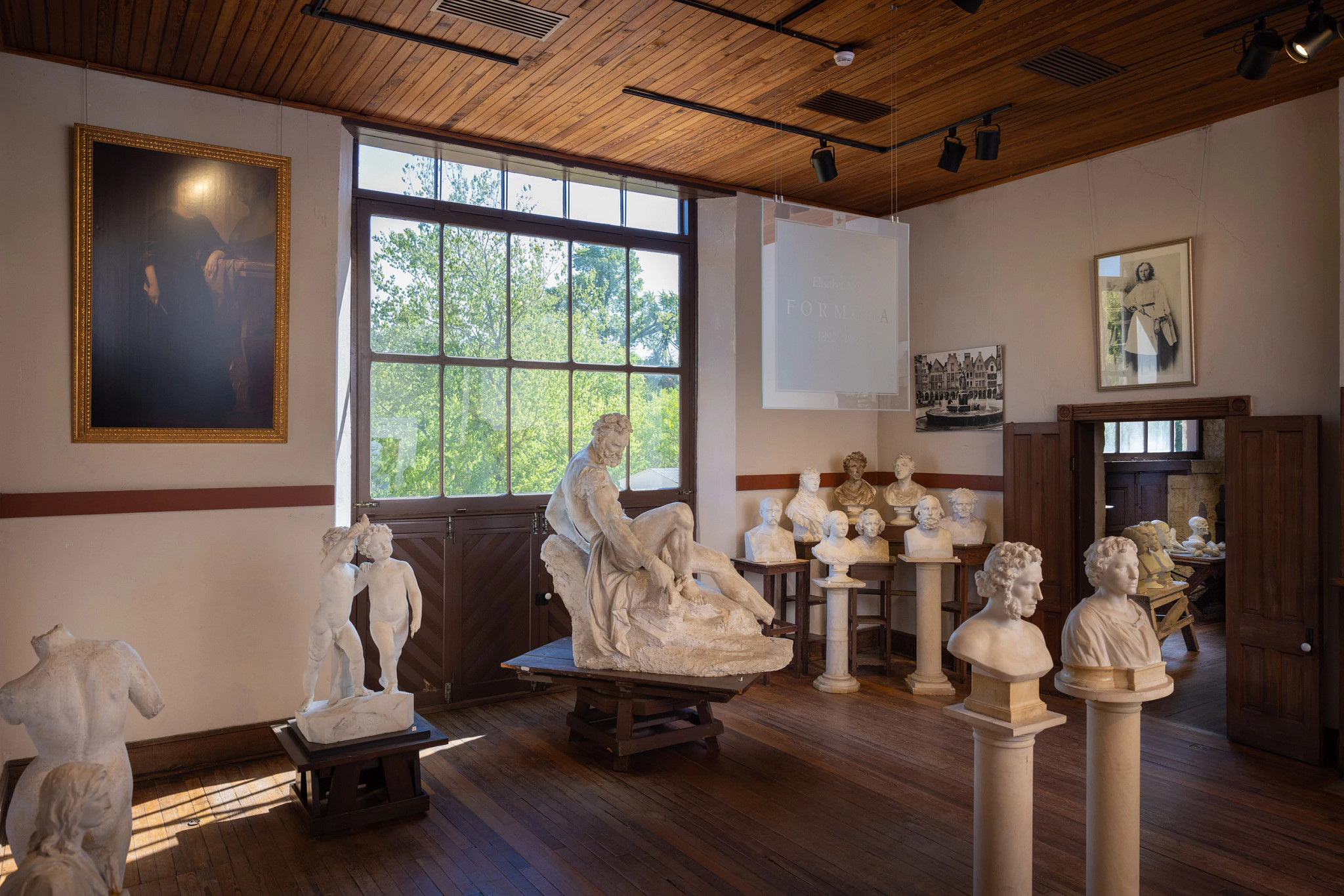 An array of portrait busts and sculptures inside a museum