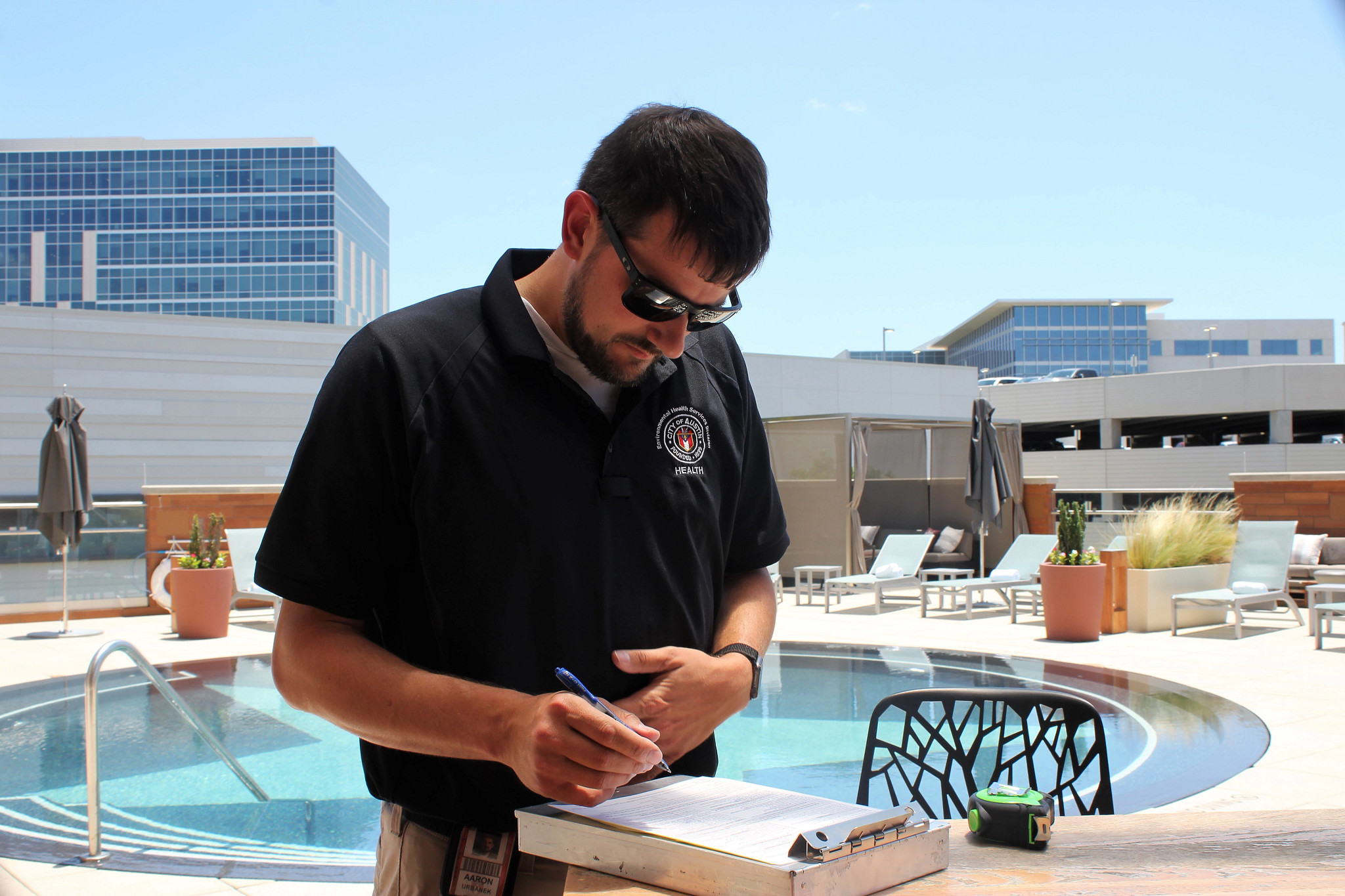 Health inspector records pool safety inspection