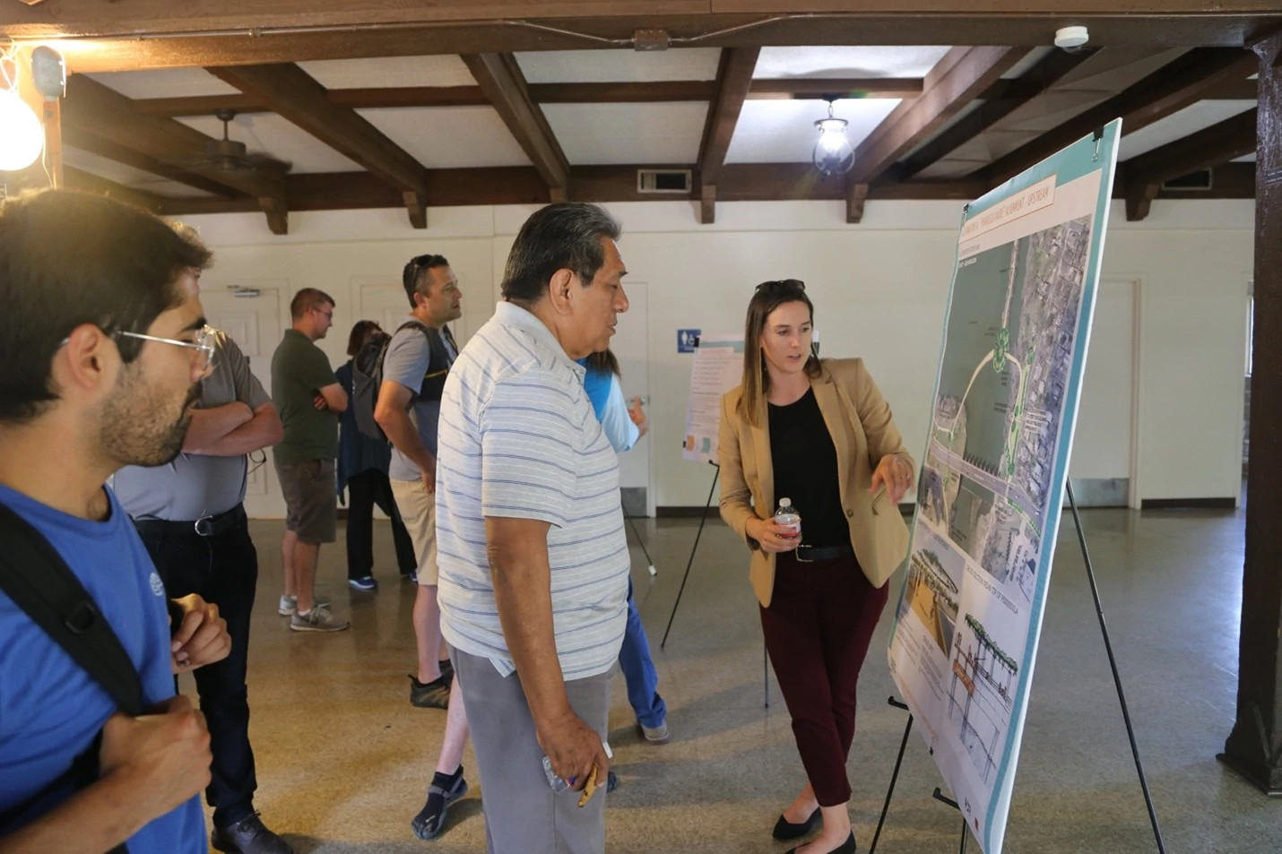 Austinites give feedback on a potential design option at a 2019 public meeting. Community input led to the selection of a y-shaped design, later earning the nickname the “Wishbone” Bridge.