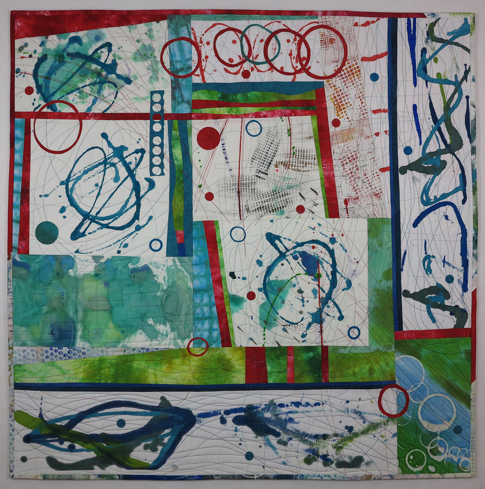 modern art quilt that is white, teal, and red