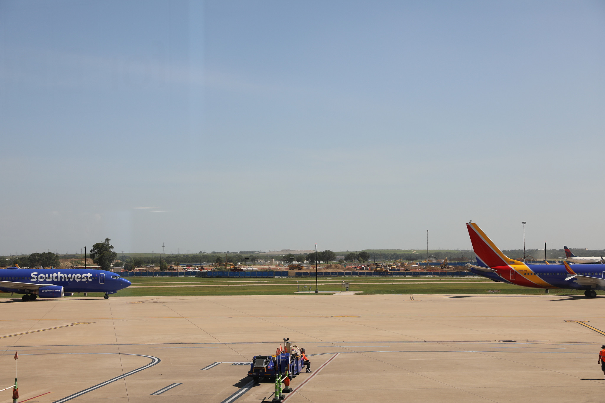 A picture showing the New Midfield Taxiways project currently under construction at Austin-Bergstrom International Airport. This picture is of the project and how it looks to passengers in the terminal.