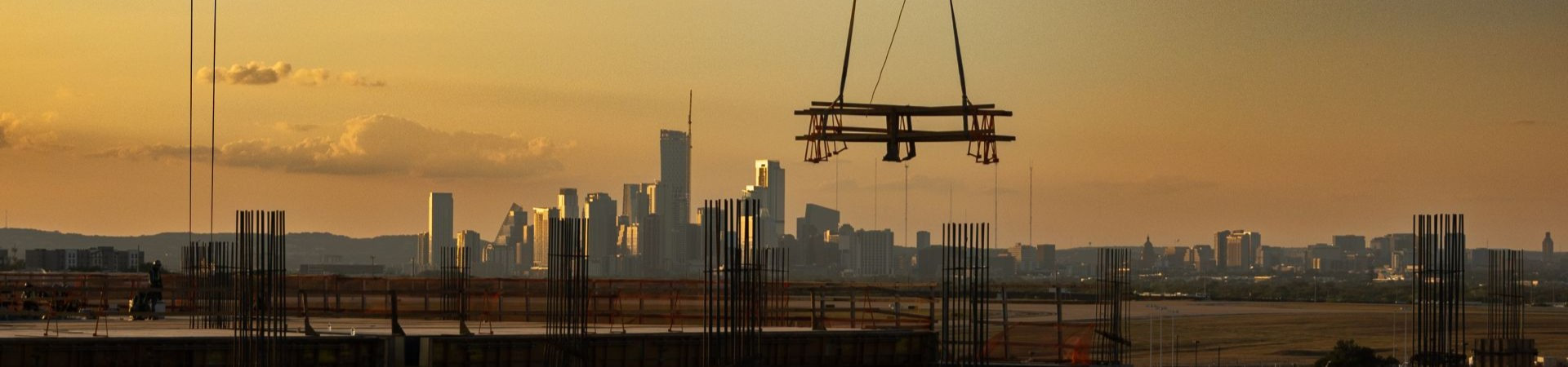 Sunset skyline of Austin with construction materials