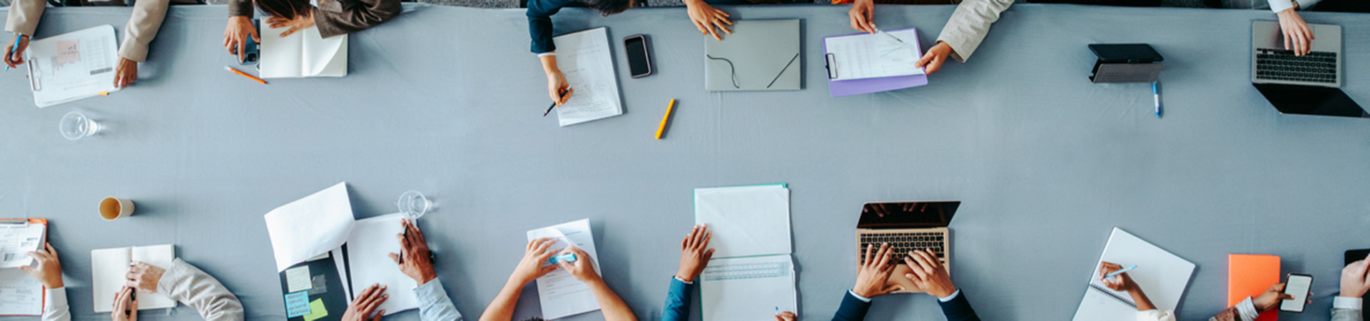 Top view of diverse group in office meeting collaborating.