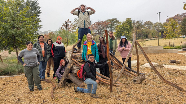 Austin Civilian Conservation Corps members at the Rainey Street Trailhead nature play area. The Trail Conservancy contracts ACCC for ecological restoration projects along the Butler Trail pose. Photo courtesy of The Trail Conservancy. 