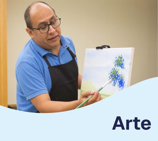 man teaching how to paint