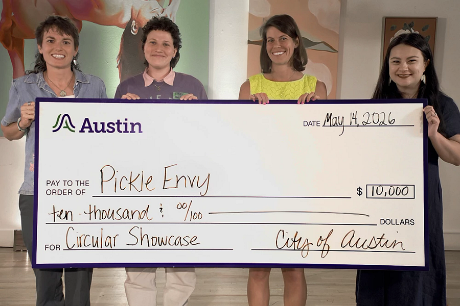 Pickle Envy, the winners of the Circular Showcase of 2026, holding the ten thousand dollar check from the City of Austin..