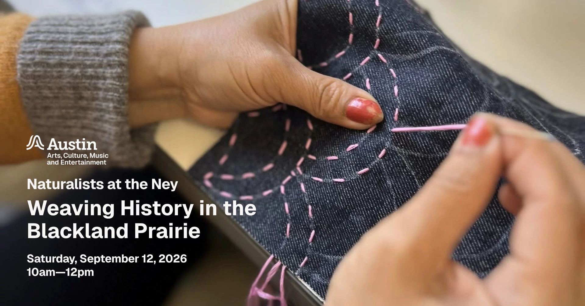 Someone weaving embroidery floss onto a piece of denim fabric