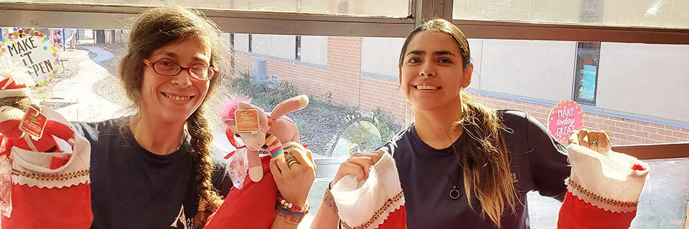 Staff holding filled stockings