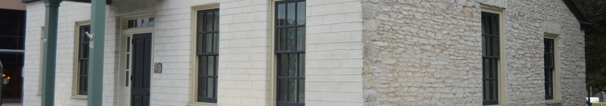 Banner with exterior of Susanna Dickinson museum