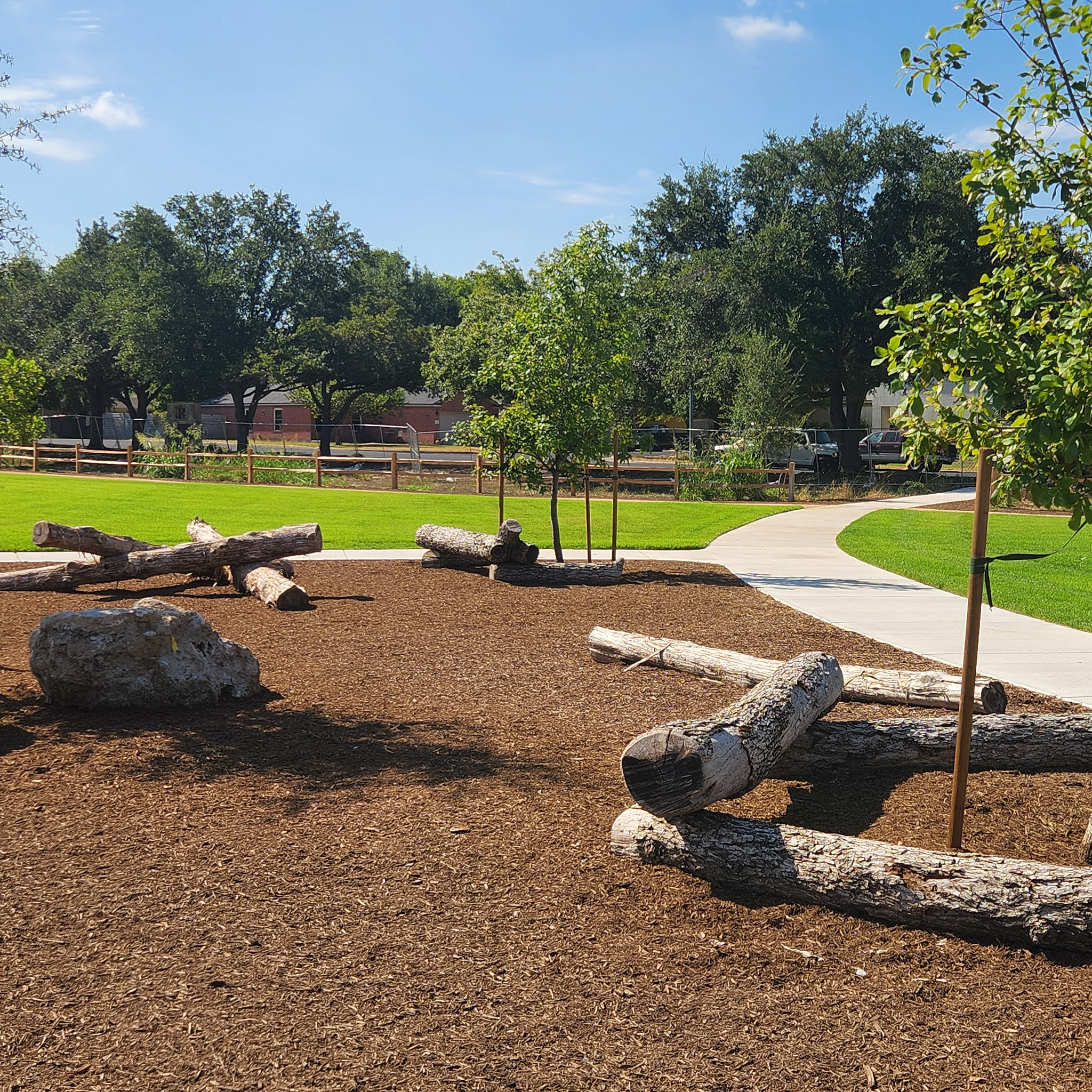 New walking paths, nature play features and tree plantings at Grand Meadow Neighborhood Park