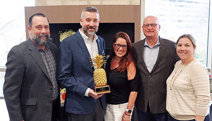 Pictured with the Spirit of Hospitality Award is the ACCD Management Team