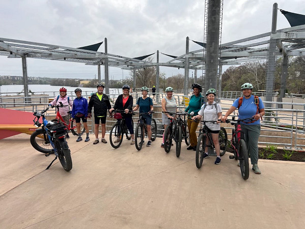 Group of senior bike riders on boardwalk trail