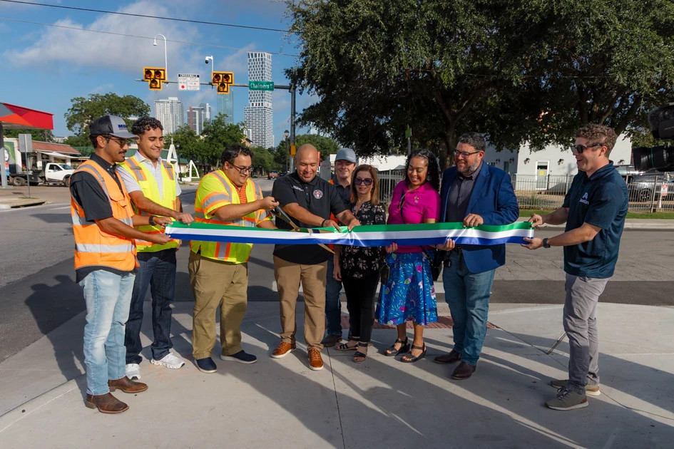 Local city leaders and Austin TPW celebrate the new signal with a ribbon cutting.