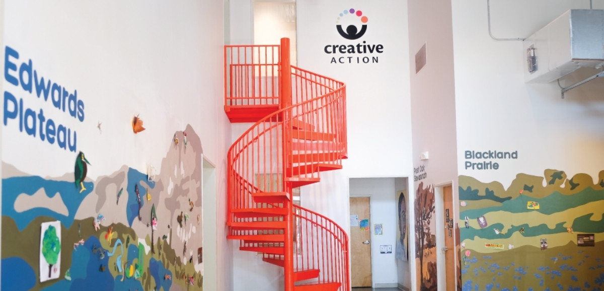 Sustainability art education mural in the foyer of the Creative Action building.