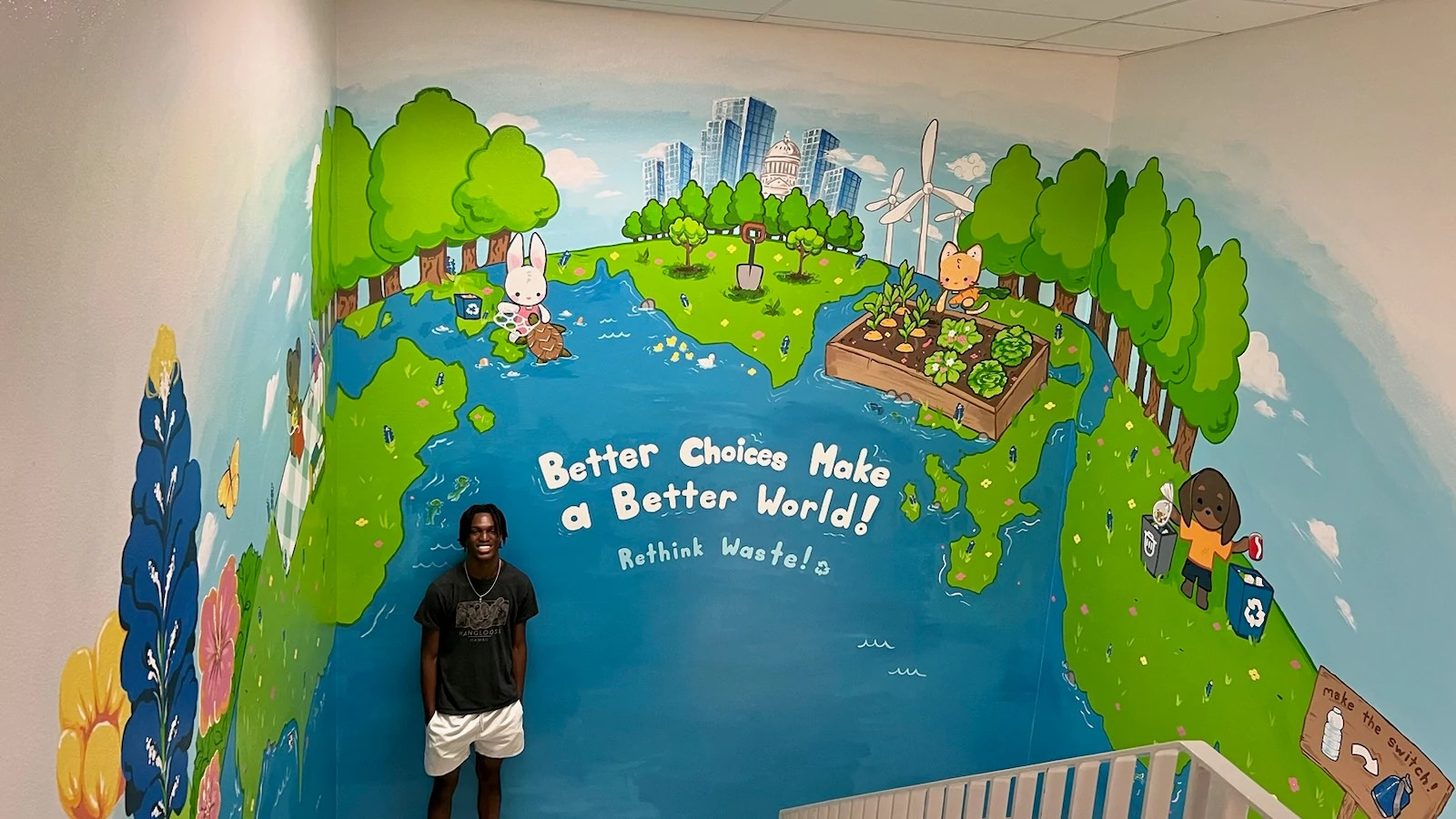 Elijah Scott with mural at LASA High