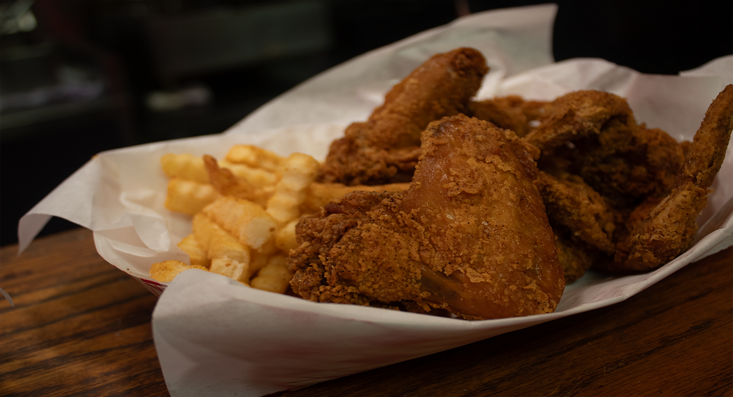 Closeup of a basket with fried chicken and fries