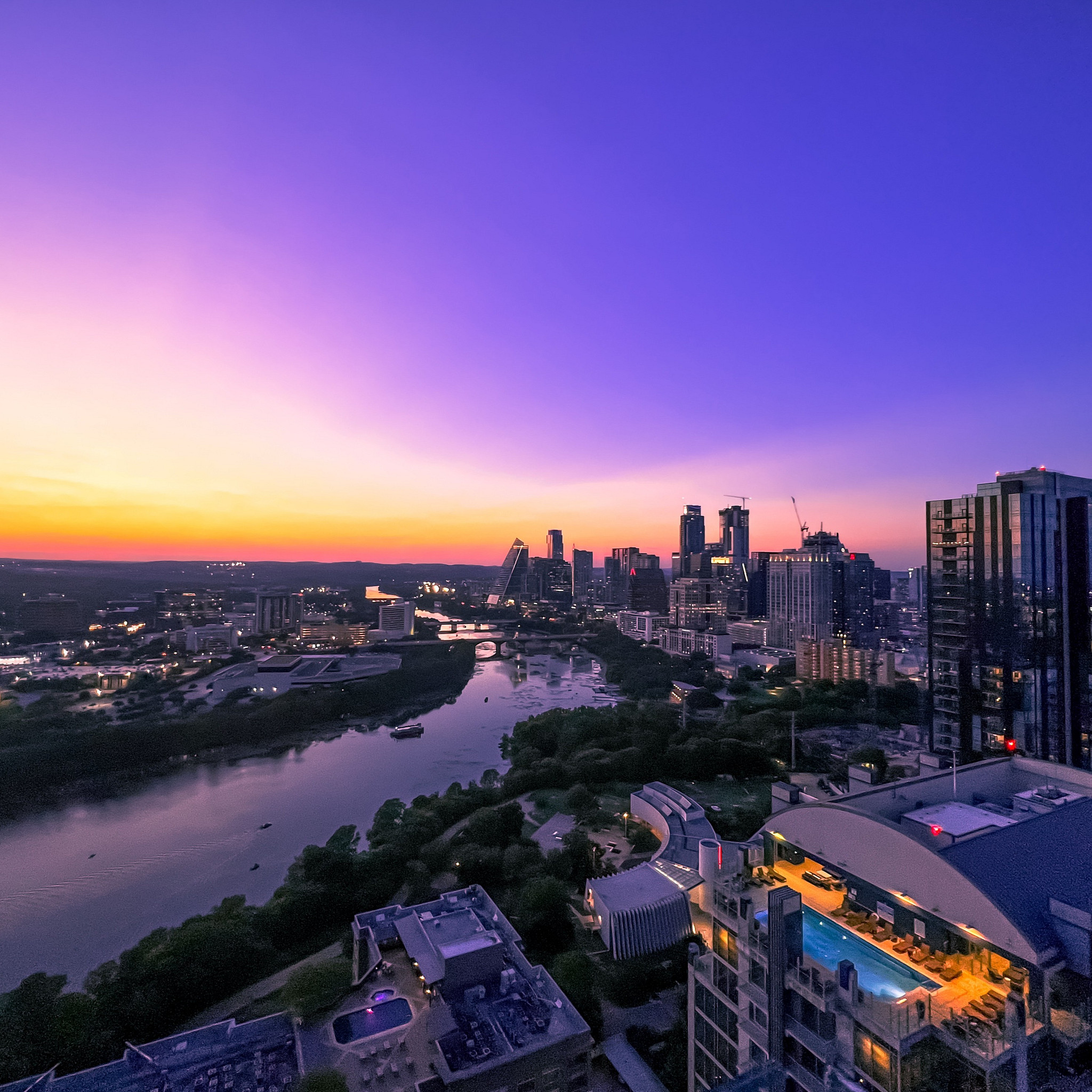 A dusk view of the downtown Austin skyline over Lady Bird Lake.