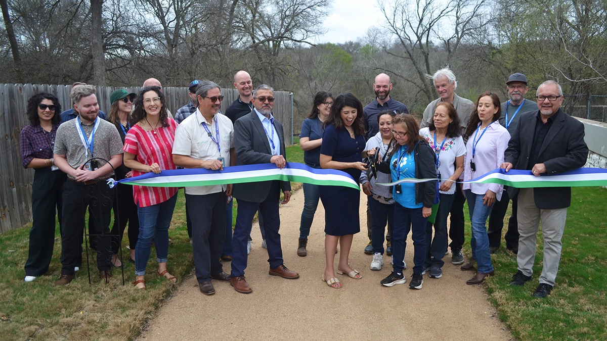 Neighbors and City leaders celebrate the completion of a community-led project along East Williamson Creek.