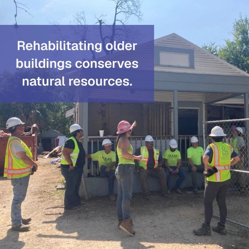 A photo of a house being deconstructed with overlaid text 'Rehabilitating older buildings conserves natural resources'.