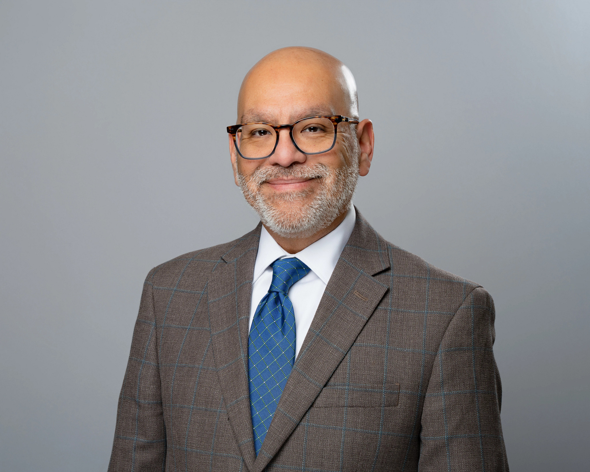 Headshot photo of Austin Small and Minority Resources Director, Edward Campos.
