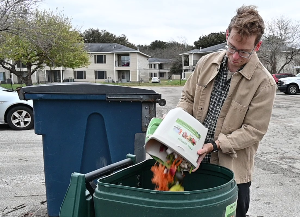 Resident placing food scraps into a compostable bin.