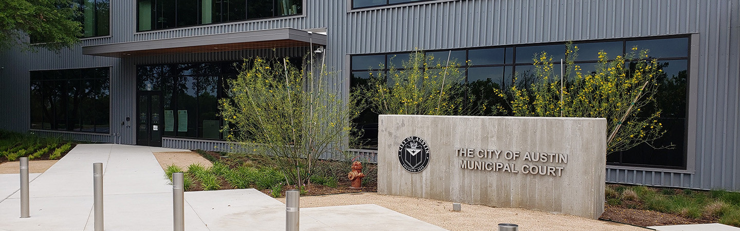 The front entrance of the Austin Municipal Court building.