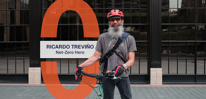 Ricardo smiles with his bike, a graphic next to him reads, Net-Zero Hero, Ricardo Trevino.