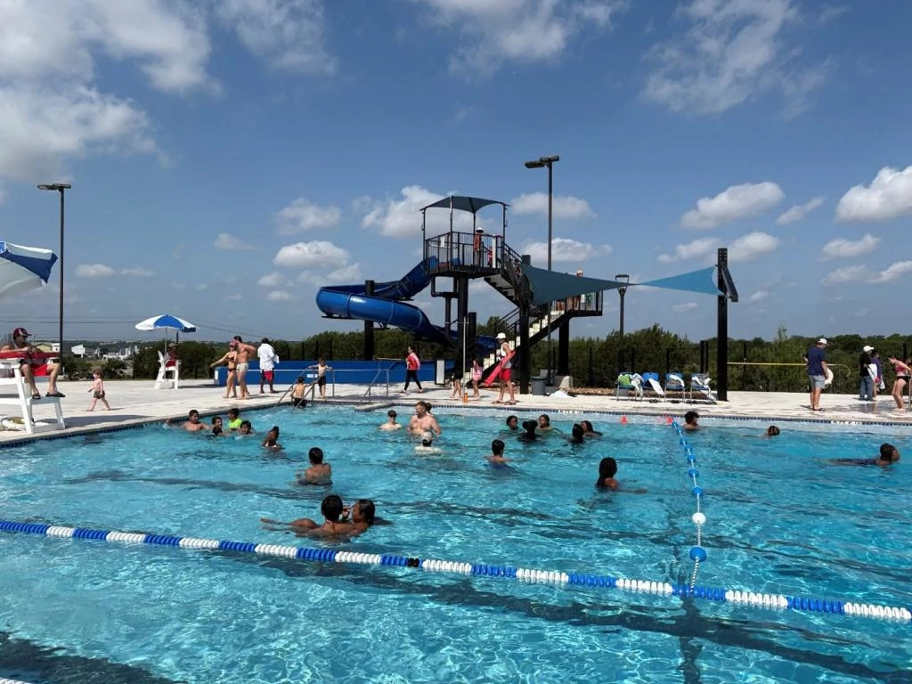 Lap area with kids playing and slide in the background