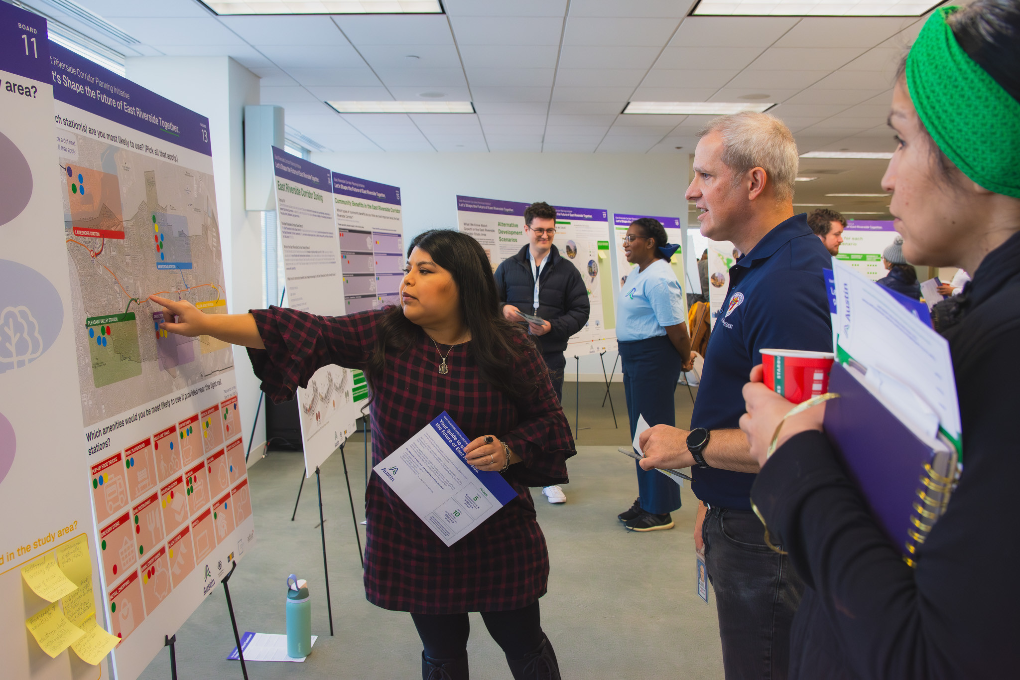 Residents viewing a map at a City of Austin open house