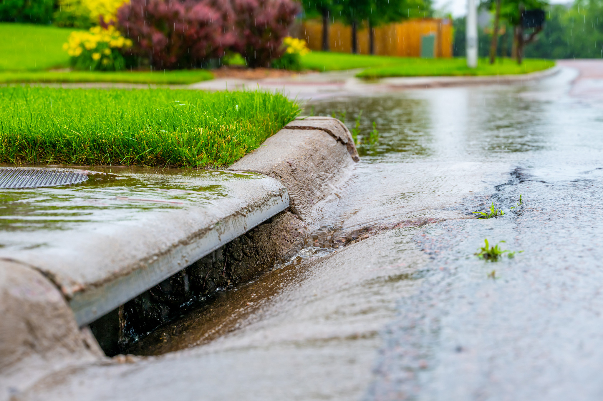 Stormwater entering curbside inlet.