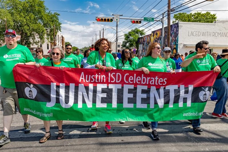 Juneteeth banner in parade.
