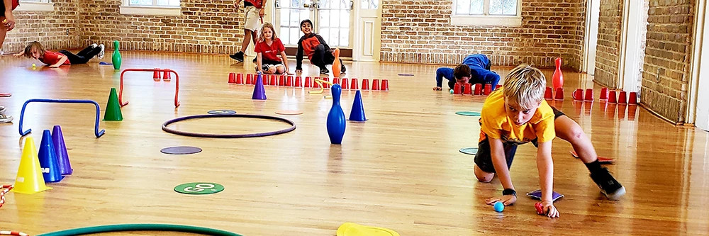 Kids having fun going through an obstacle course.